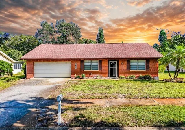 a front view of a house with a garden and porch
