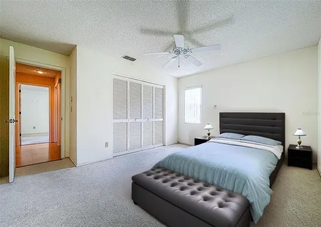 a bedroom with a bed and a couch