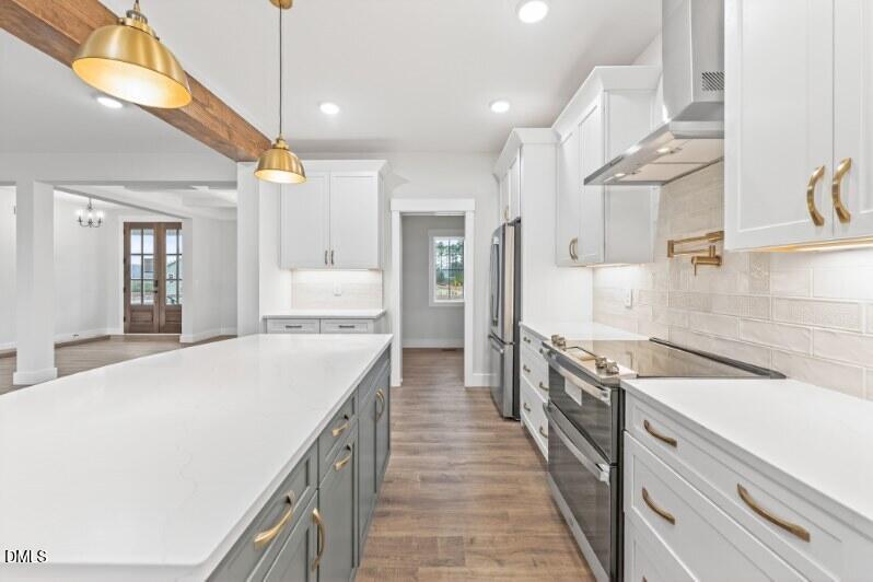 8 Trey Point Dr Spring Spring Hope, NC 27882 - Photo 5 of 31 a large kitchen with stainless steel appliances granite countertop a lot of counter space and wooden floors