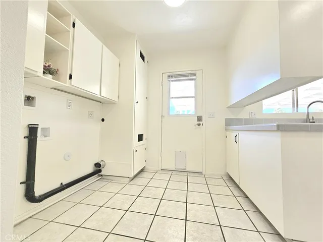 a view of a utility room with closet