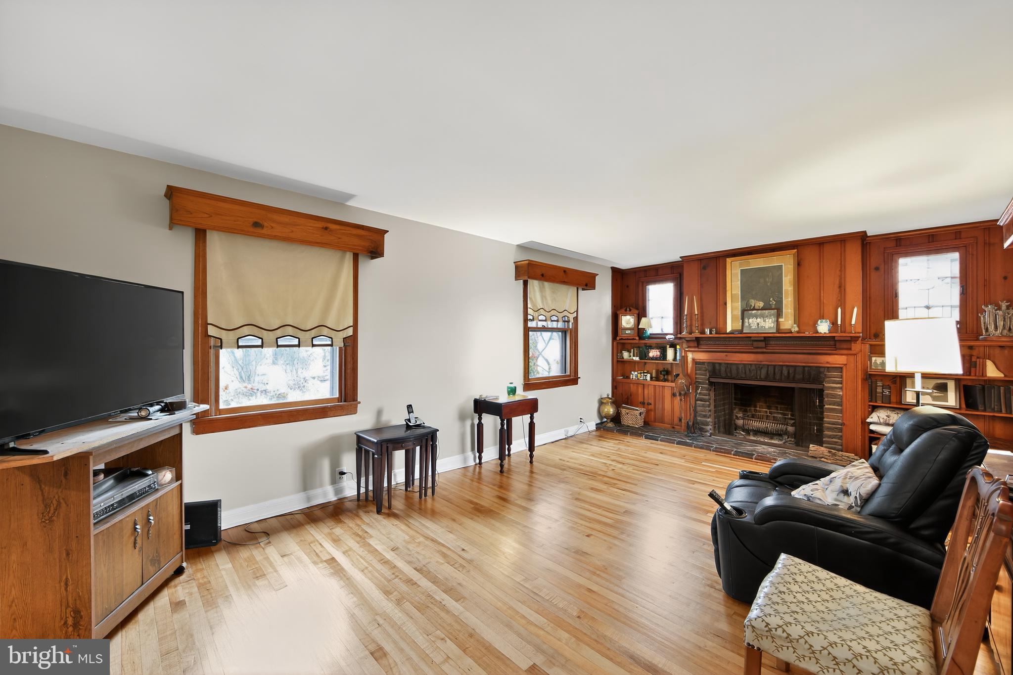 31 Barren Road Newtown Square, PA 19073 - Photo 5 of 27 a living room with furniture a fireplace and a flat screen tv