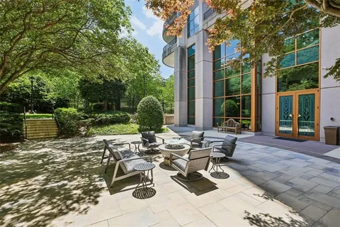 a view of a park with large trees