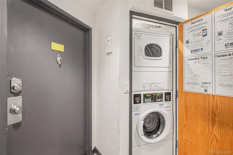 a view of a storage and utility room with washer and dryer