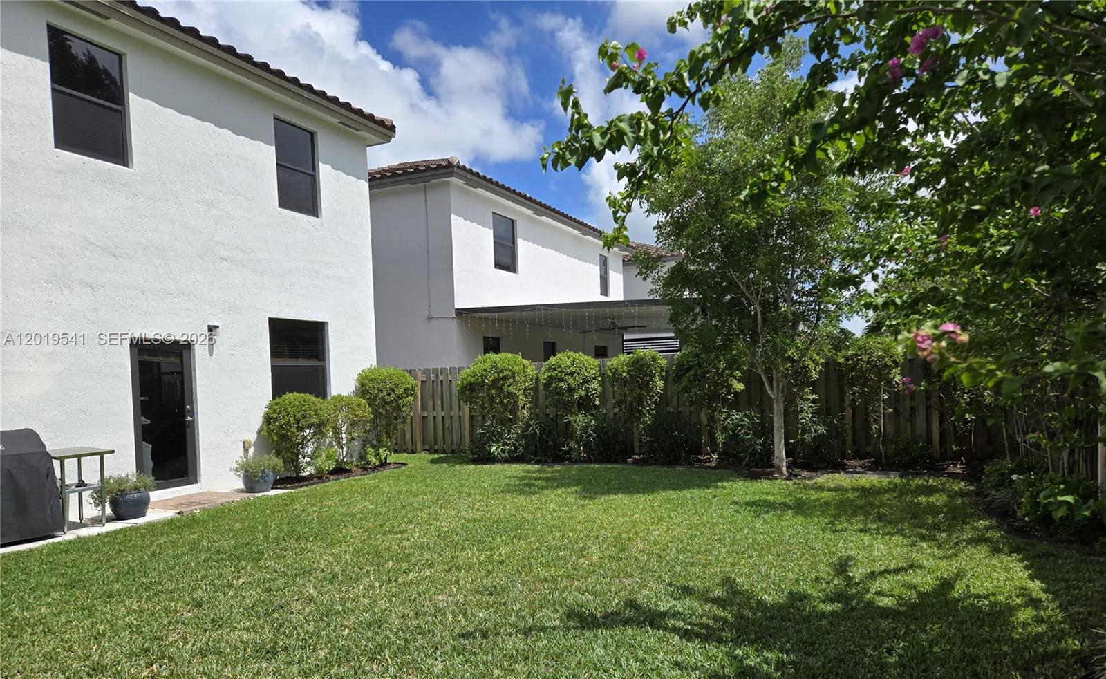 24400 Southwest 119th Place Homestead, FL 33032 - Photo 10 of 22 a front view of house with yard and green space