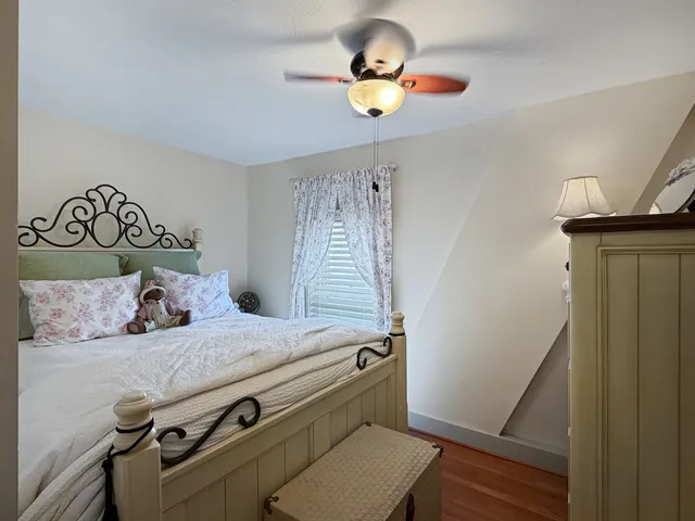 a bedroom with furniture and a chandelier