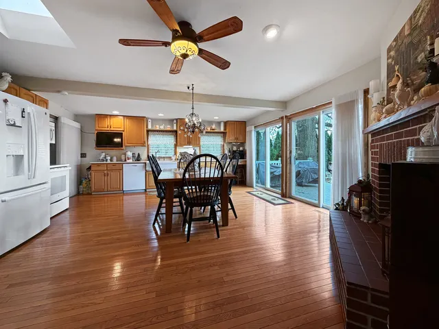 a view of a chairs and table in a backyard