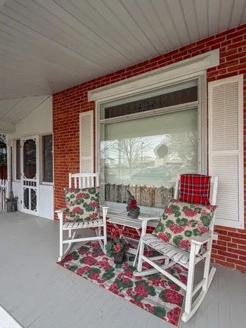a view of a house with a small yard