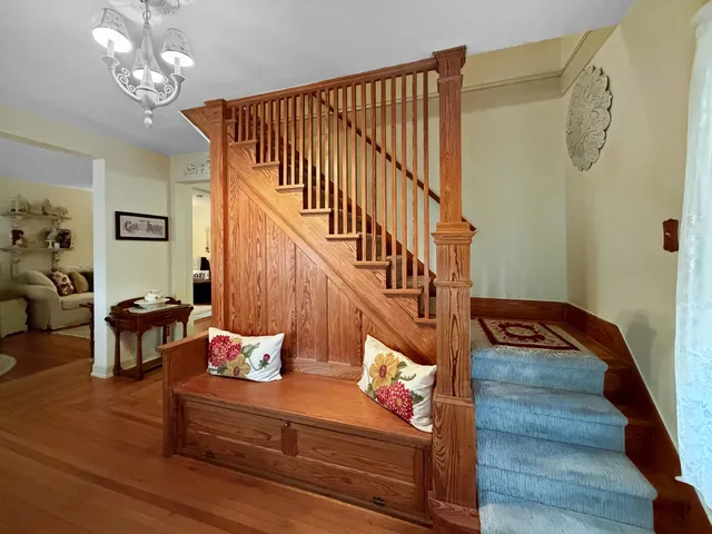 a view of entryway dining room and hall with wooden floor