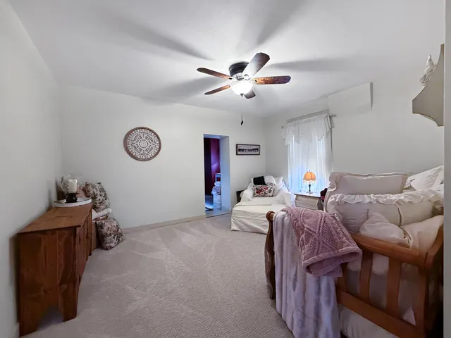 a bed room with furniture and a window