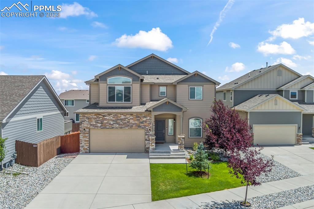 13232 Park Meadows Drive Peyton, CO 80831 - Photo 1 of 23 front view of a house with a yard