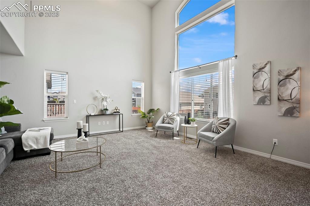 13232 Park Meadows Drive Peyton, CO 80831 - Photo 13 of 23 a living room with furniture and a large window