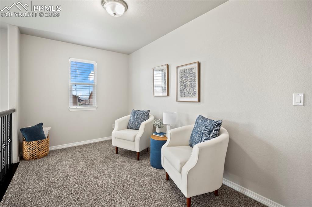 13232 Park Meadows Drive Peyton, CO 80831 - Photo 16 of 23 a living room with furniture and a window