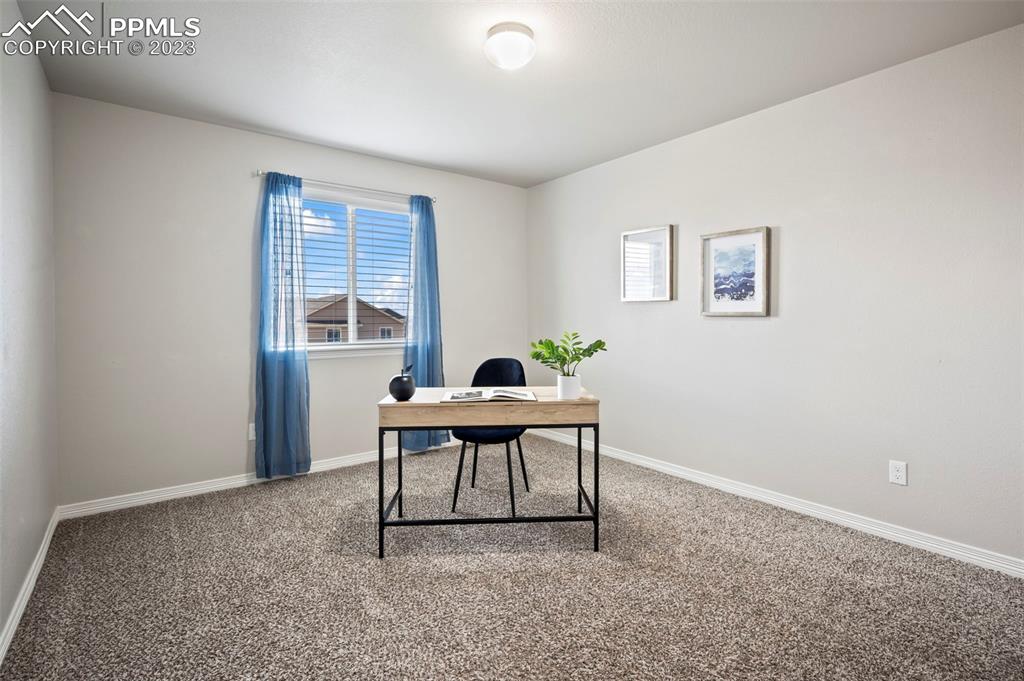 13232 Park Meadows Drive Peyton, CO 80831 - Photo 21 of 23 a workspace room with furniture and window