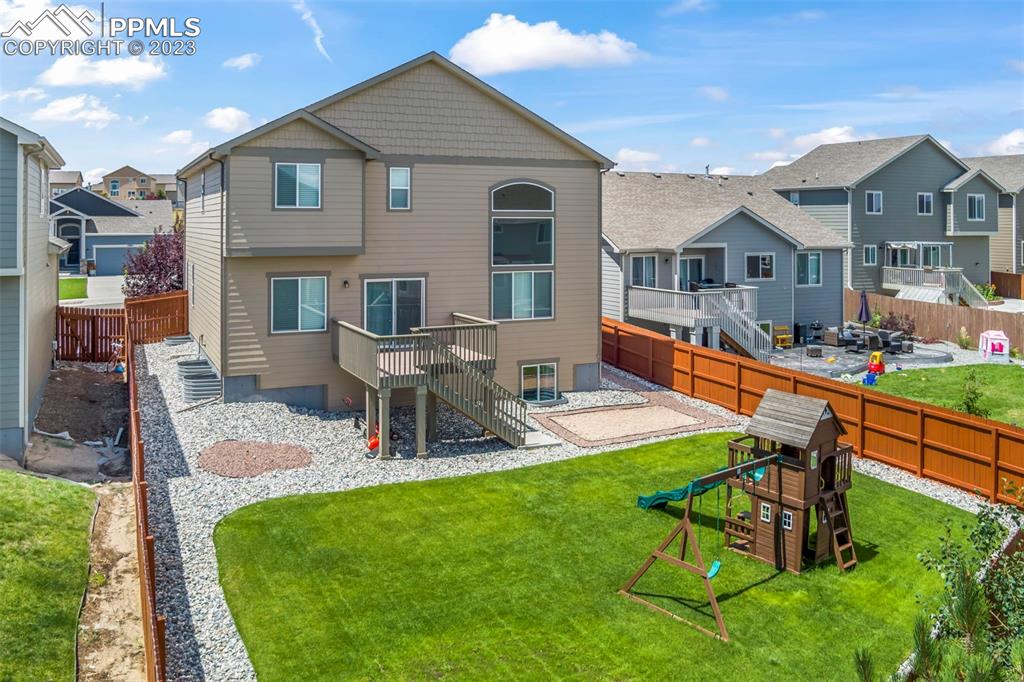 13232 Park Meadows Drive Peyton, CO 80831 - Photo 3 of 23 a house view with outdoor seating space and garden