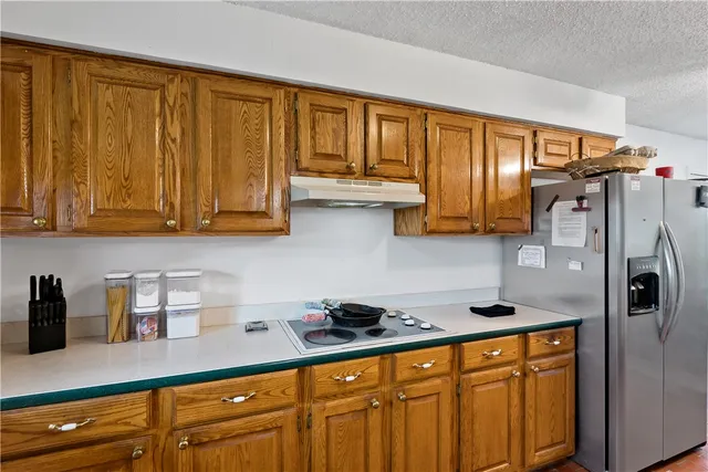 a room with furniture a flat screen tv and a window