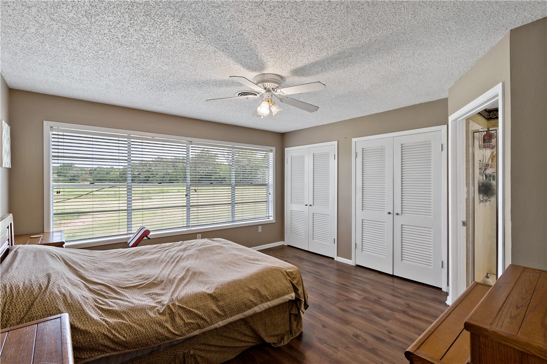 8166 Riley Road Bryan, TX 77808 - Photo 26 of 47 a bed sitting in a bedroom next to a window