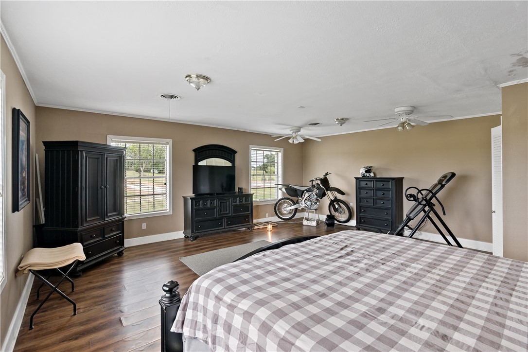 8166 Riley Road Bryan, TX 77808 - Photo 29 of 47 a bed room with a bed and a flat screen tv