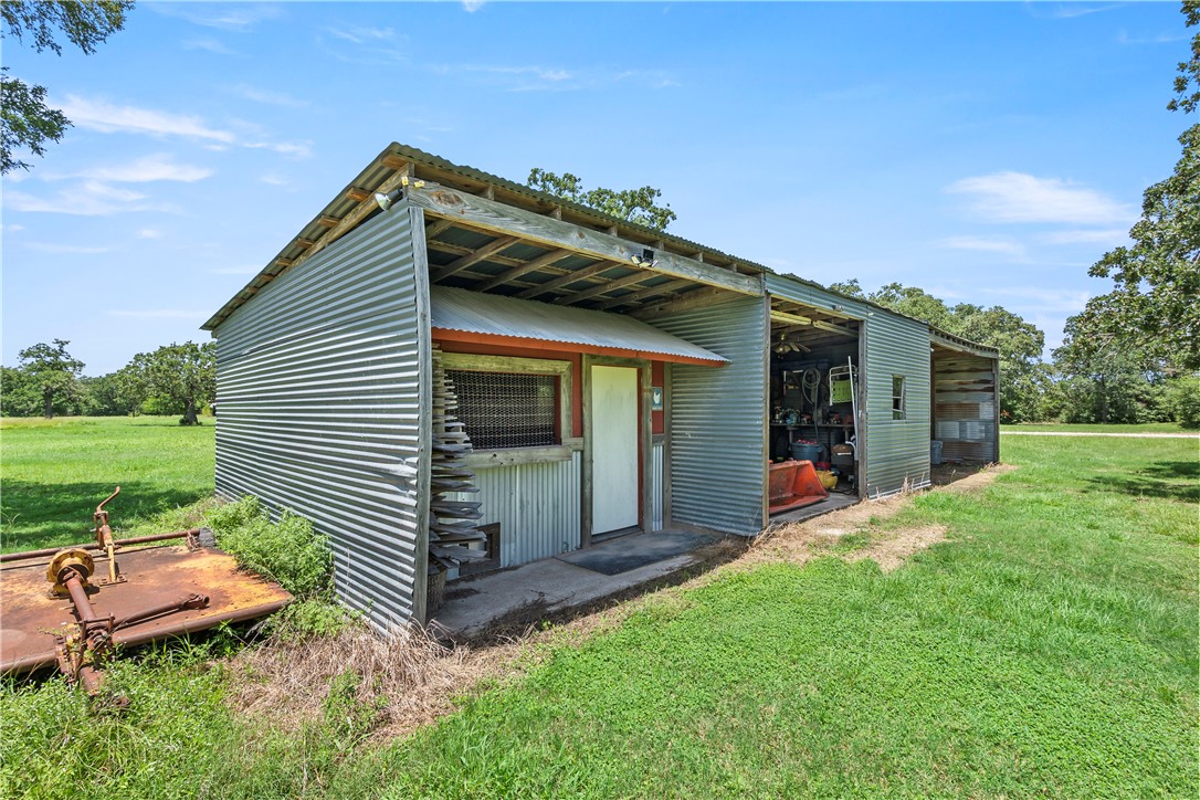 8166 Riley Road Bryan, TX 77808 - Photo 37 of 47 a view of a house with backyard and a garden