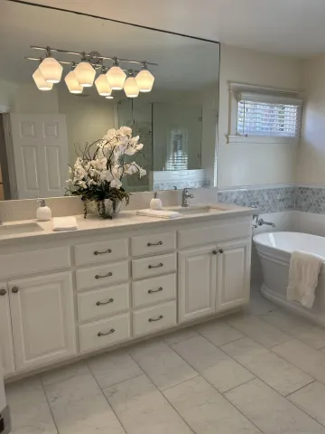 a bathroom with a sink a vanity and a mirror