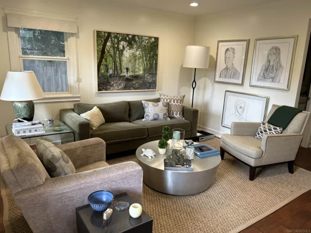 a living room with furniture and a lamp