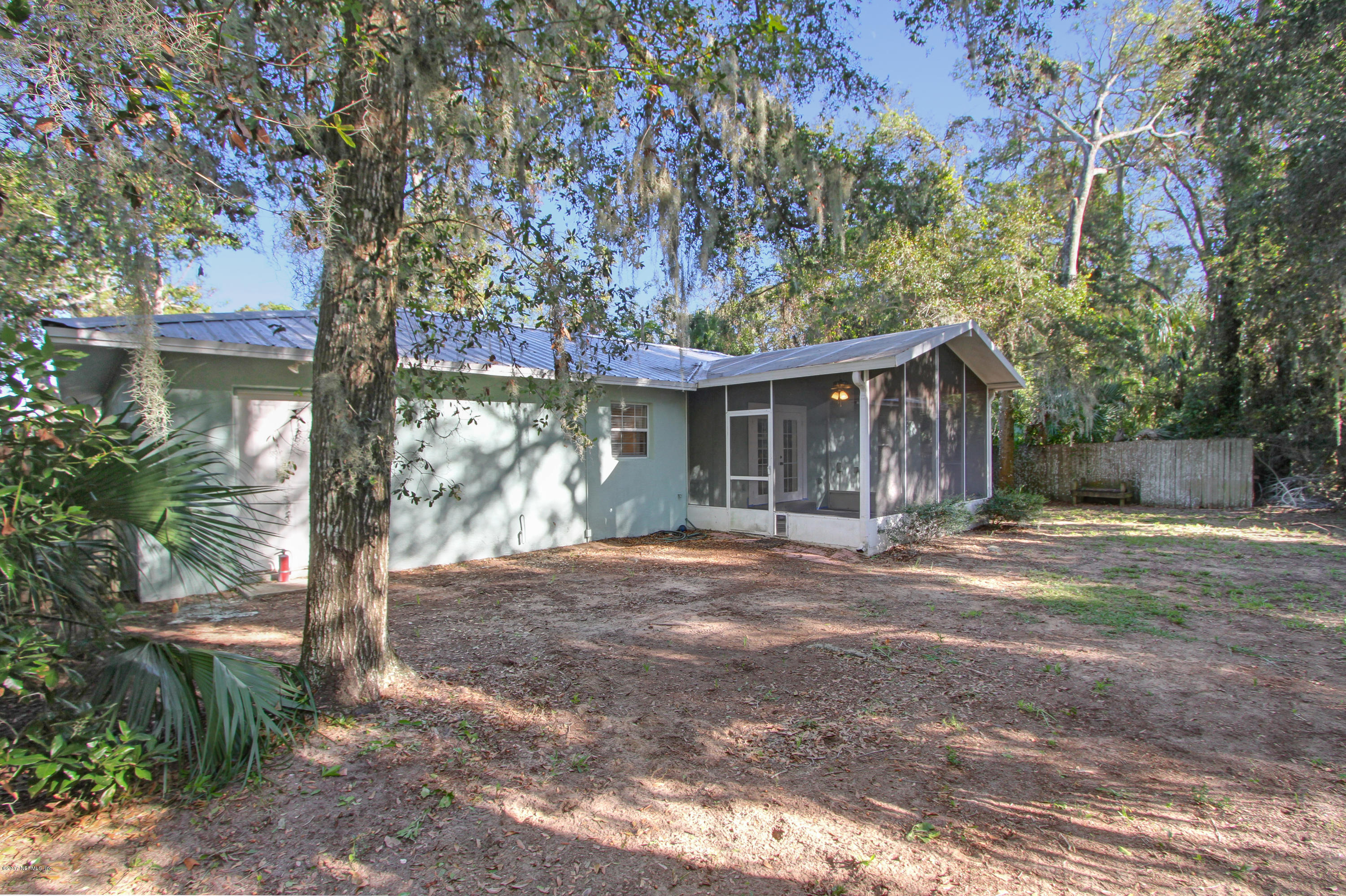 810 Gerona Road St. Augustine, FL 32086 - Photo 3 of 22 a front view of a house with a garden