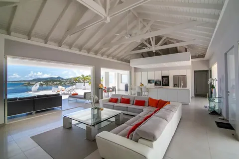 a living room with furniture pool table and a large window