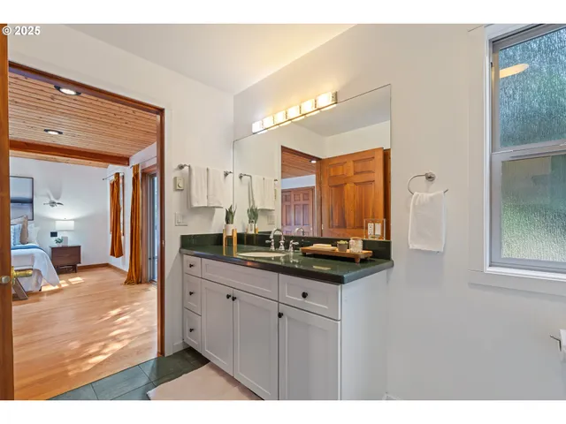 a kitchen with stainless steel appliances granite countertop a sink and cabinets