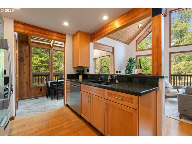 a kitchen with a sink and large window