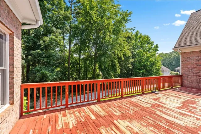 a workspace with wooden floor and windows
