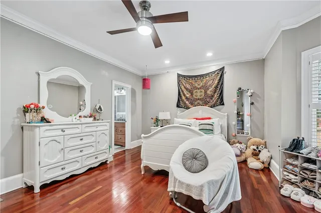 a spacious bedroom with a large bed and a large window