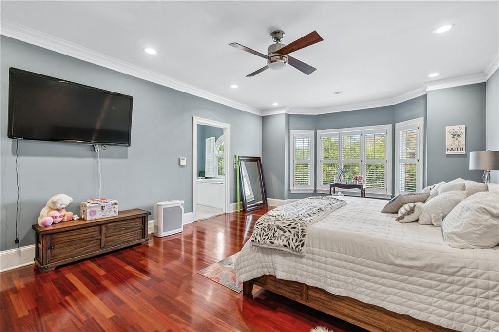 2012 Arbor Springs Way Buford, GA 30519 - Photo 20 of 61 a bedroom with a bed window and a flat screen tv