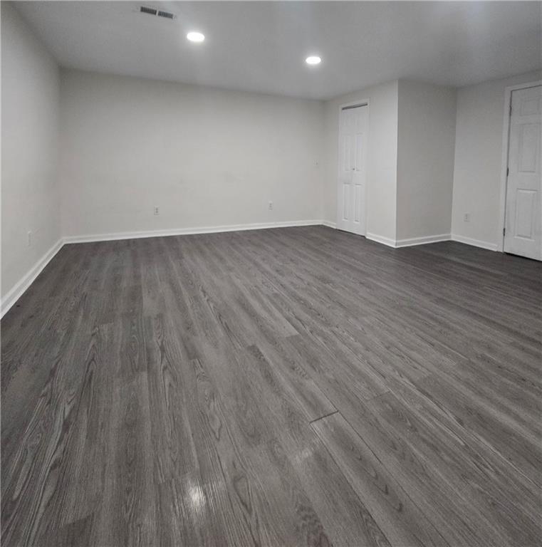2012 Arbor Springs Way Buford, GA 30519 - Photo 38 of 61 an empty room with wooden floor and windows