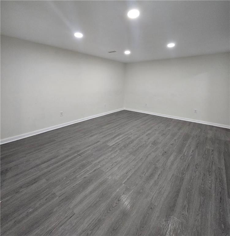 2012 Arbor Springs Way Buford, GA 30519 - Photo 40 of 61 a view of an empty room with wooden floor and a window
