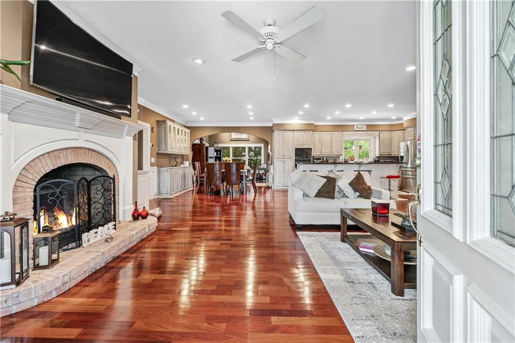 2012 Arbor Springs Way Buford, GA 30519 - Photo 4 of 61 a living room with stainless steel appliances furniture or fireplace and a flat screen tv