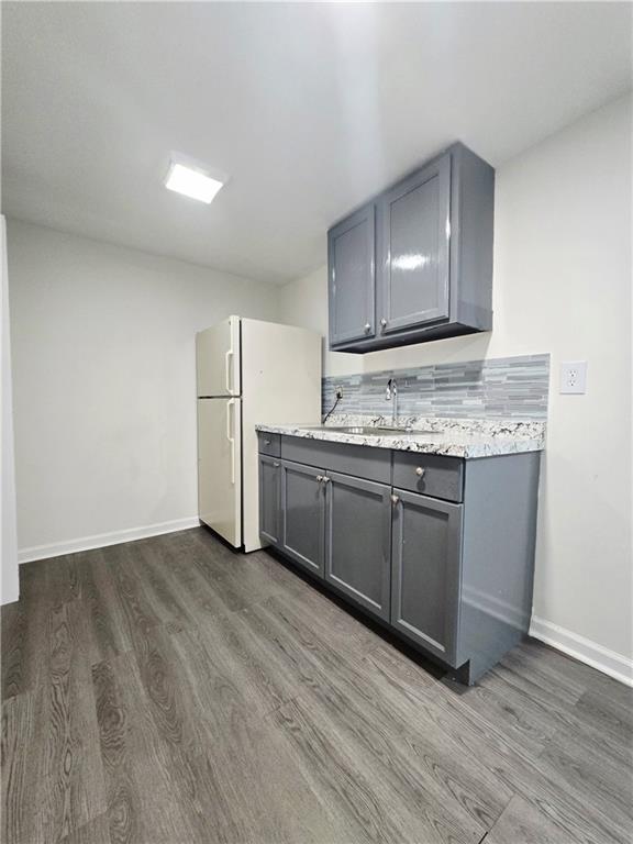 2012 Arbor Springs Way Buford, GA 30519 - Photo 42 of 61 a kitchen with a sink and a refrigerator