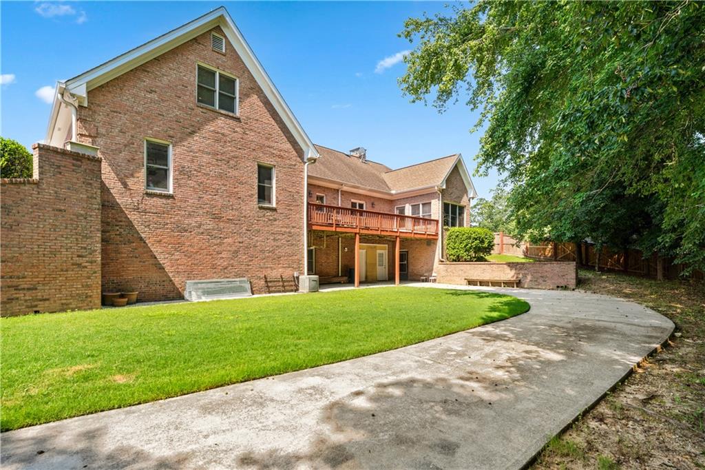 2012 Arbor Springs Way Buford, GA 30519 - Photo 53 of 61 a front view of a house with a yard and trees