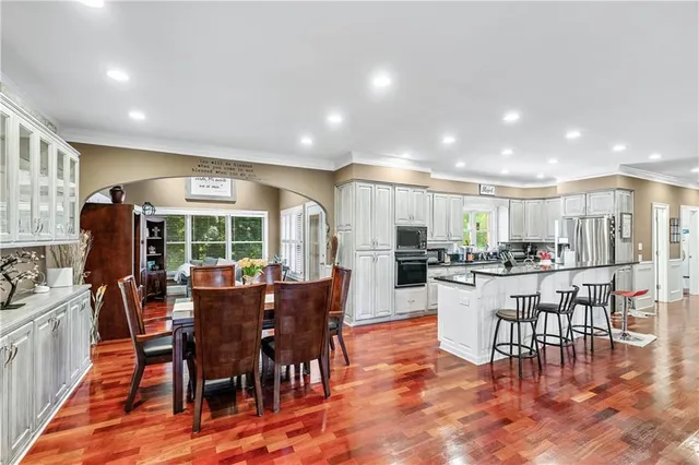 a living room with furniture fireplace and a flat screen tv