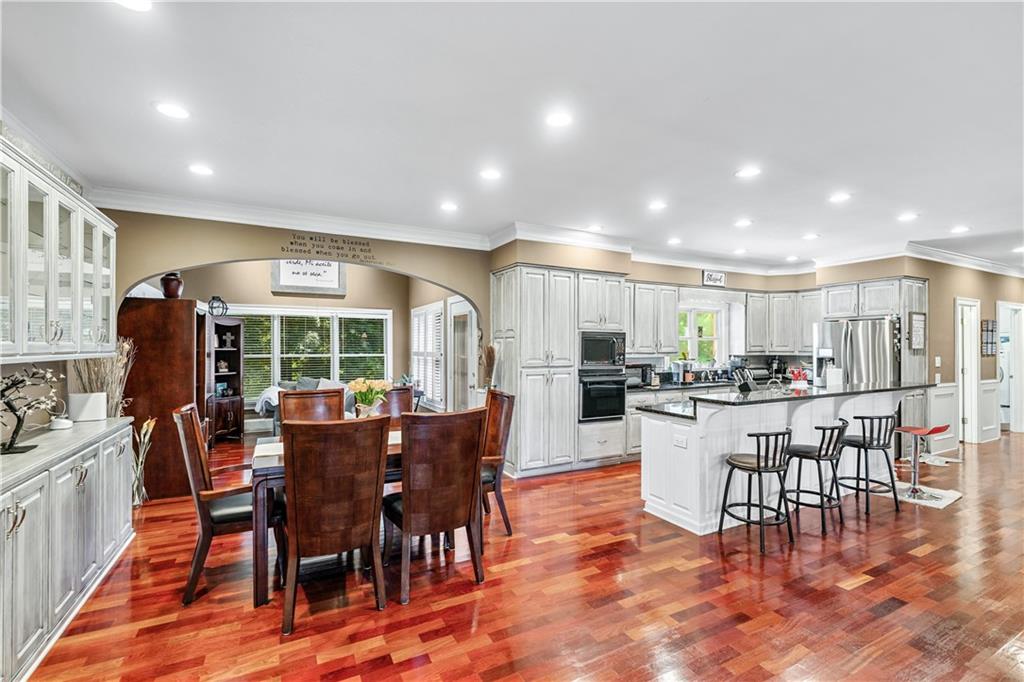 2012 Arbor Springs Way Buford, GA 30519 - Photo 6 of 61 a view of a dining room with furniture window and outside view