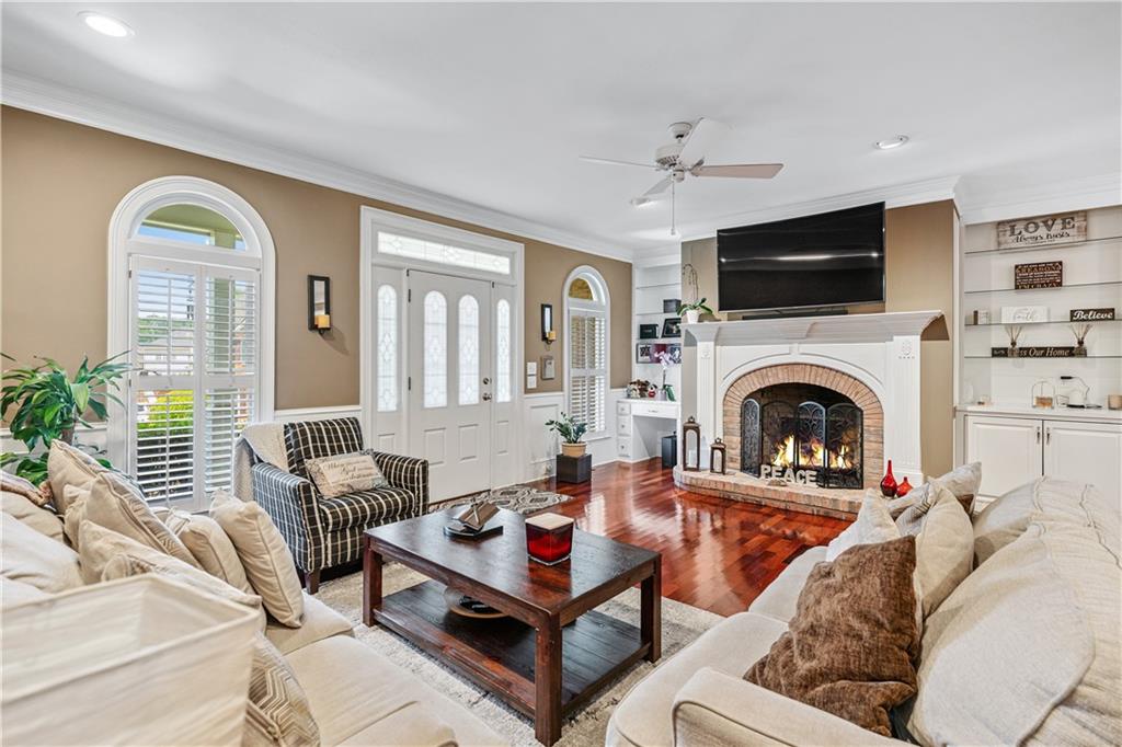2012 Arbor Springs Way Buford, GA 30519 - Photo 9 of 61 a living room with furniture fireplace and a flat screen tv