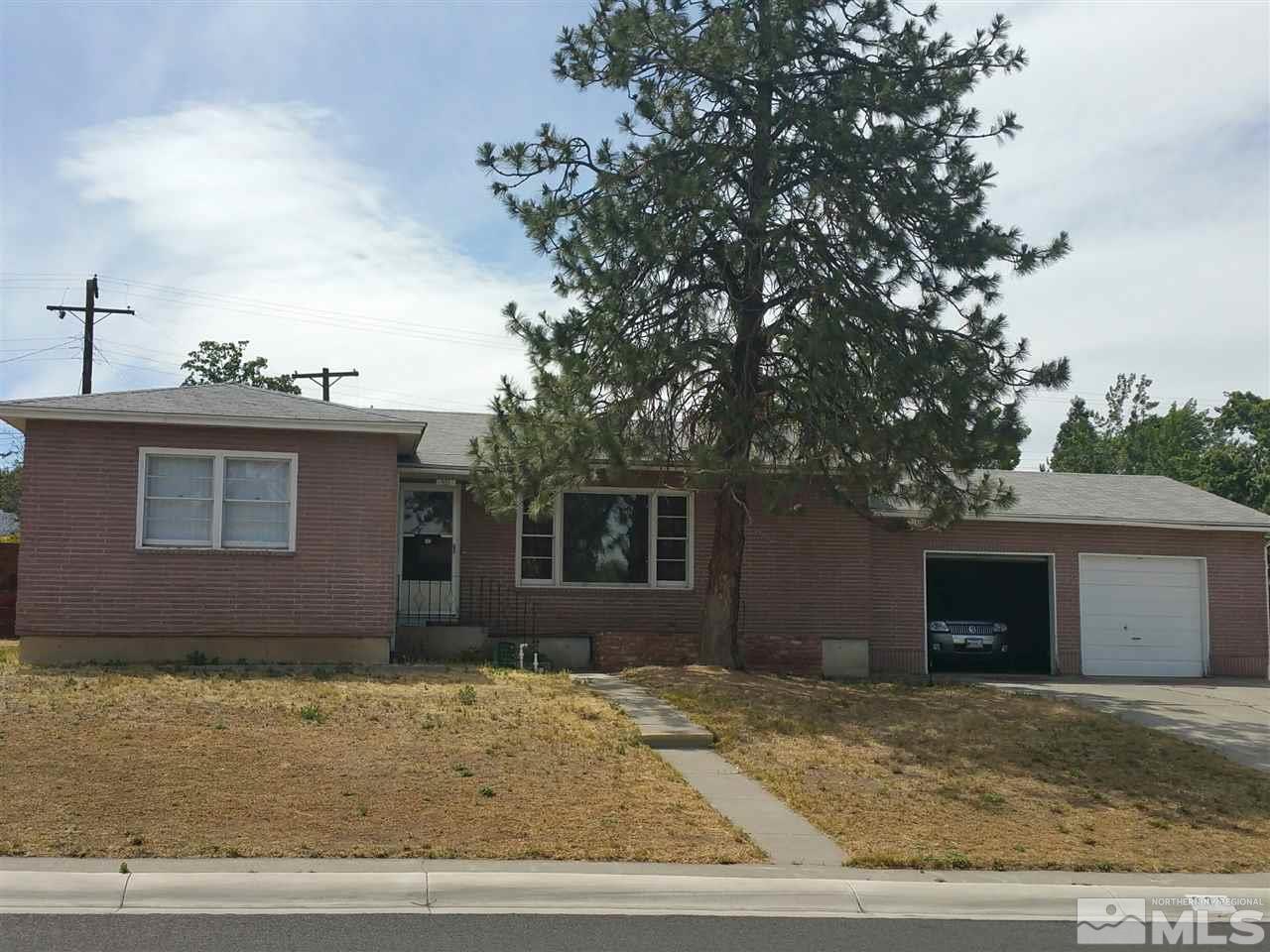 921 Mallard Place Reno, NV 89503 - Photo 1 of 1 a house that has a tree in front of it