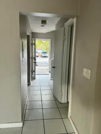 a view of a living room with a large window