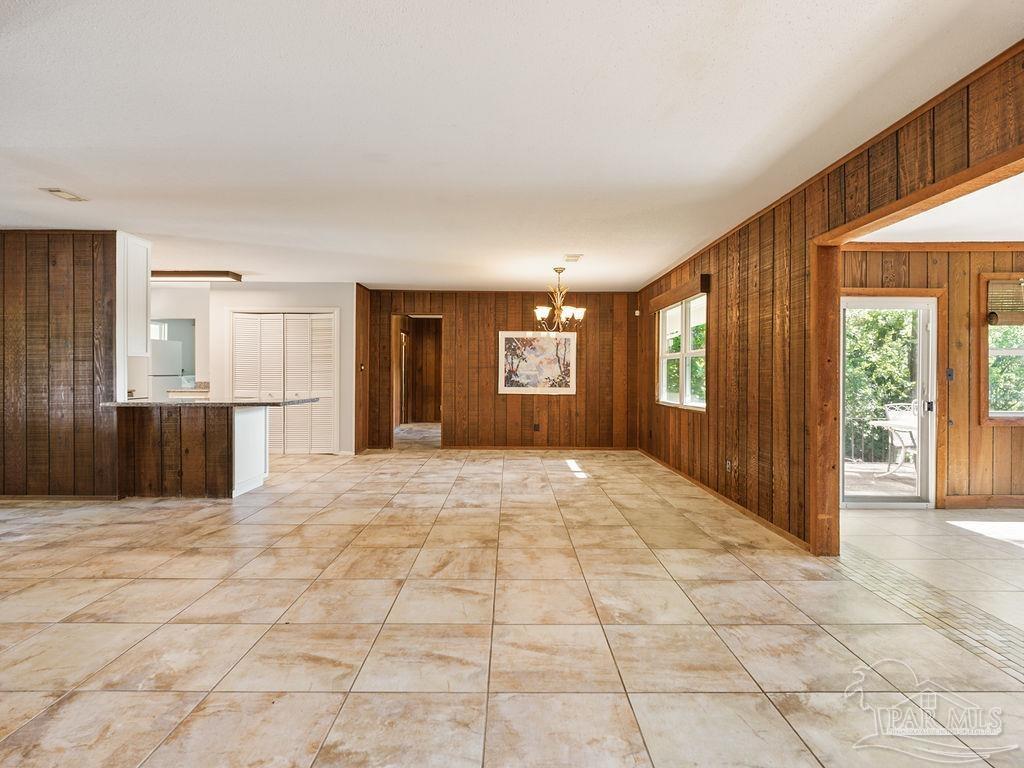 609 Dog Track Road Pensacola, FL 32506 - Photo 13 of 22 a view of an empty room with a window