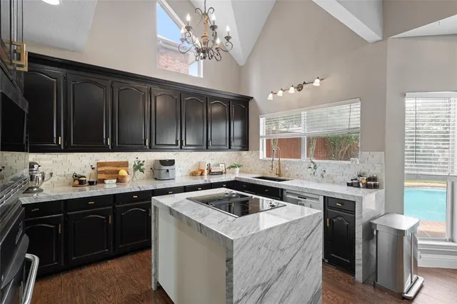 a kitchen with a sink and cabinets