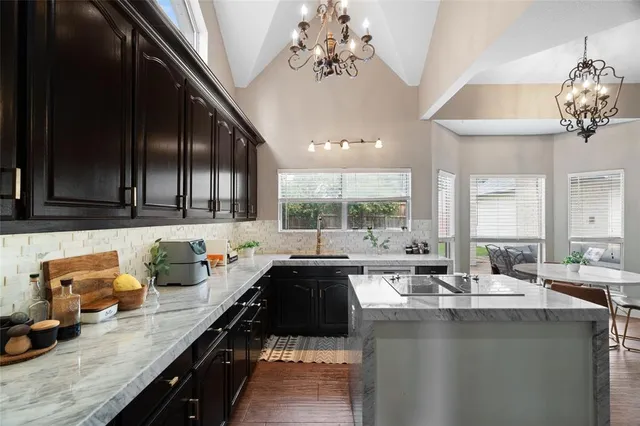 a kitchen with a sink and lots of counter top space