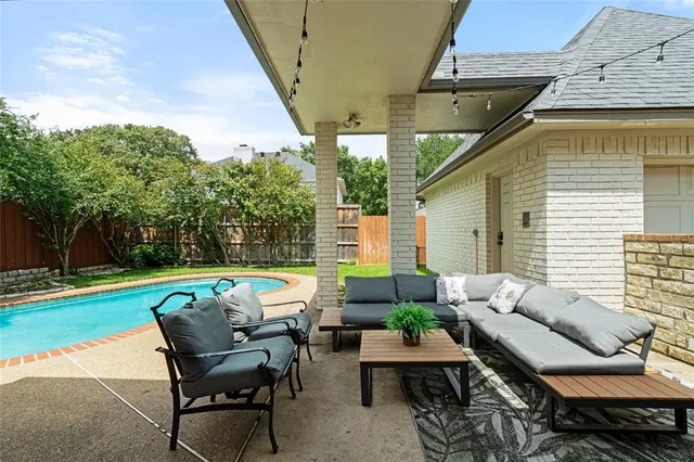 a patio with patio table and chairs