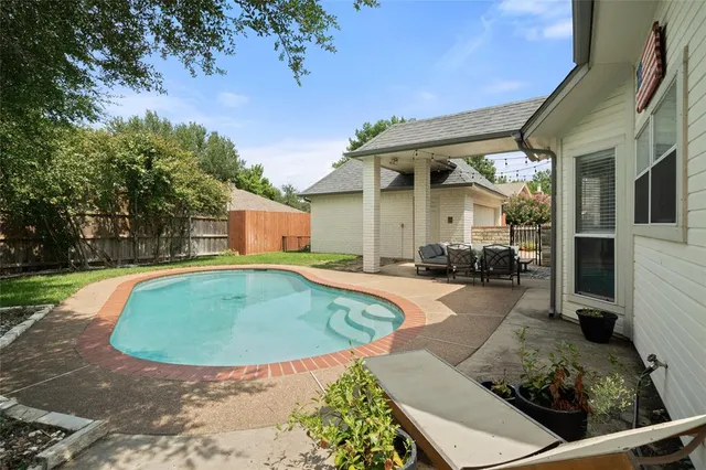 a view of a house with swimming pool