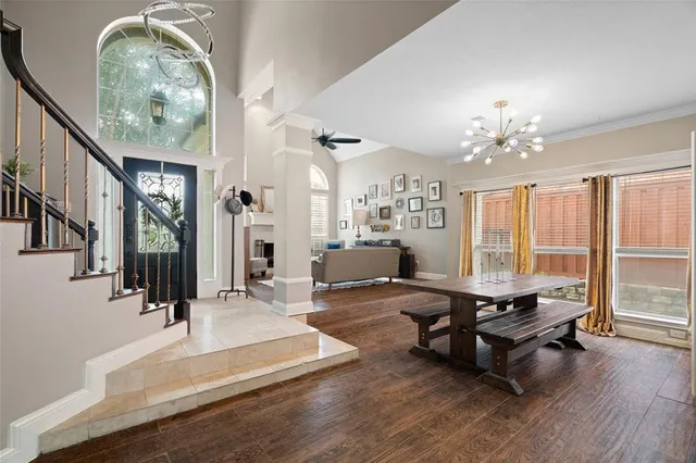 a living room with furniture a table and decor