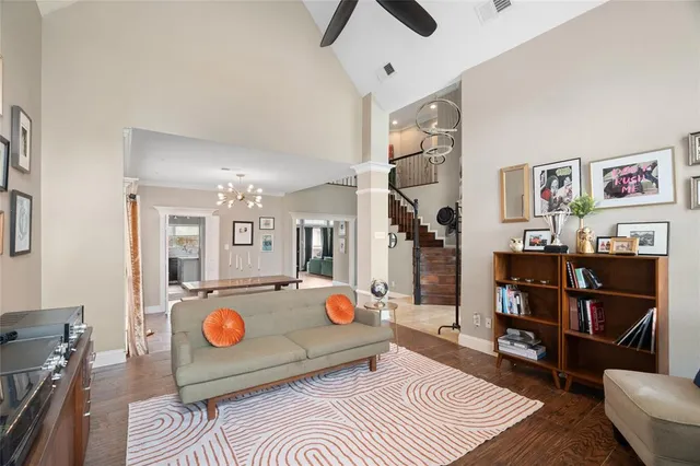 a bedroom with a bed wooden floor and window