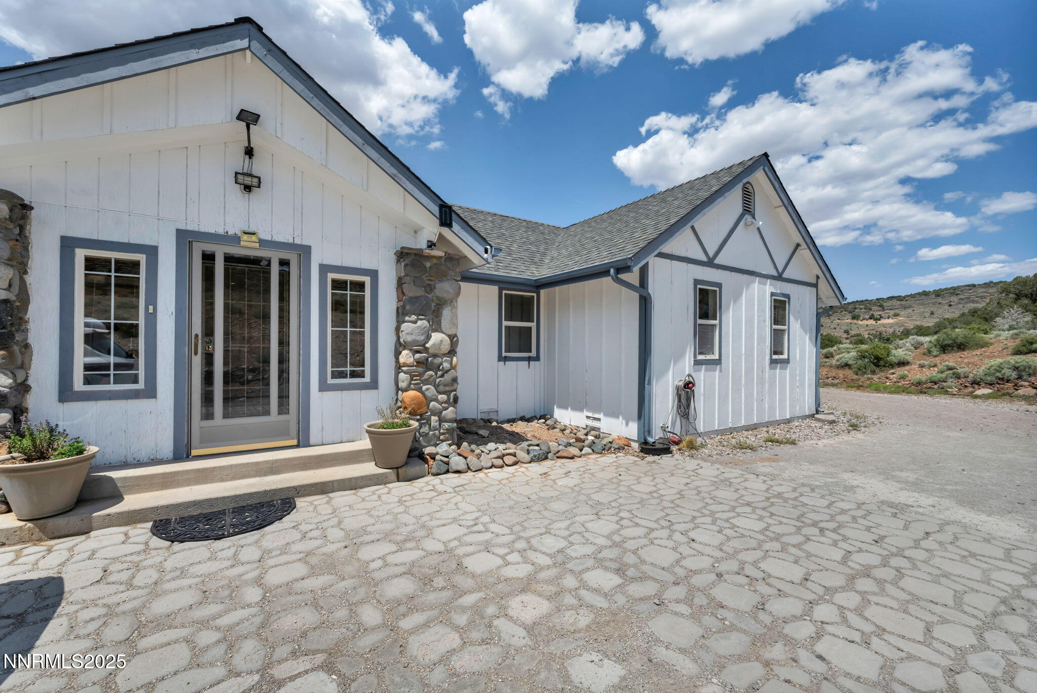 a front view of a house with a yard outdoor seating and barbeque oven
