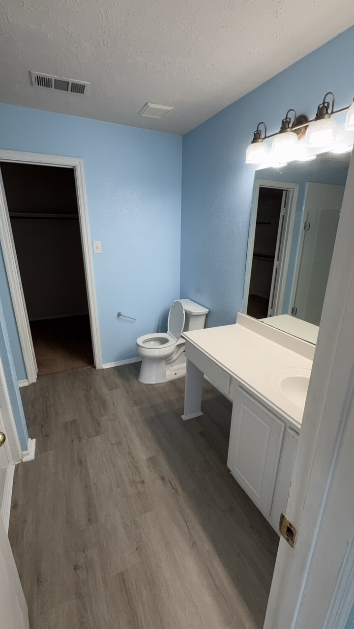 6014 Pinacle Point Houston, TX 77085 - Photo 22 of 27 a bathroom with a sink and mirror